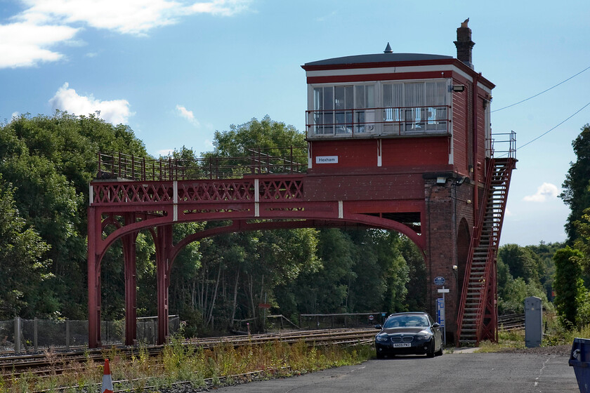 Hexham signal box (NE, 1918) 
 Hexham signal box is a remarkable structure being one of just two remaining over-line elevated type designs. There were once a number of these in the northeast with just two remaining, the other being at nearby Wylam. Hexham's box is located to the east of the station and is Grade II listed and once controlled an extensive yard the site of which I am standing on to take the photograph that is now occupied by some large retail outlets that looked as though they were on the verge of opening with construction all but complete. The date of construction of this fine structure is in dispute. The SRS suggests that it be circa 1918 but Historic England states it to be 1896; further evidence is needed to be gleaned on this! 
 Keywords: Hexham signal box 1918 North Eastern Railway