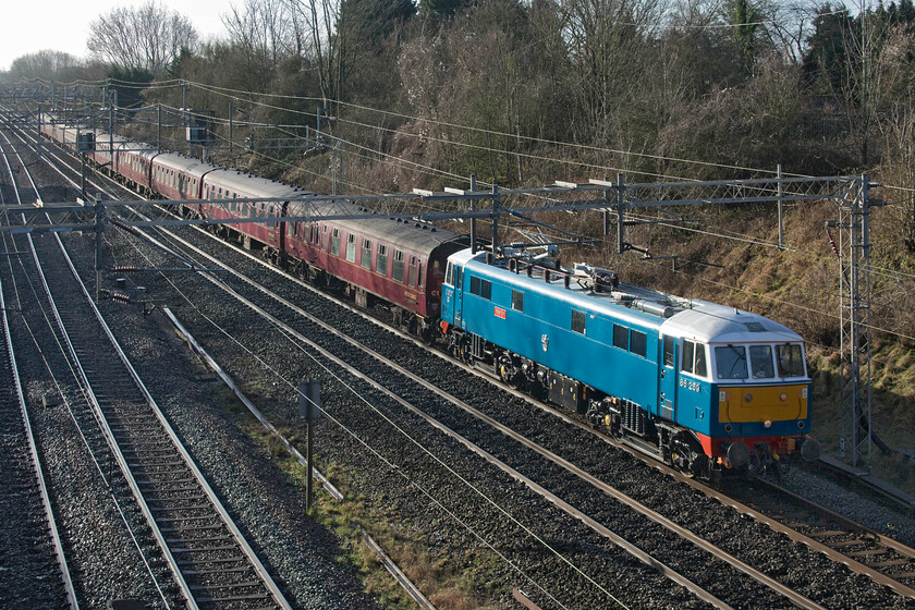 86259, outward leg of The Cumbrian Coast Express, 07.08 London Euston-Carlisle (1Z86, RT), Victoria bridge 
 The first Cumbrian Coast Express charter of the year passes Victoria bridge between Ashton and Roade hauled as usual by 86259' Les Ross/Peter Pan'. The AC electric that looks absolutely superb in the early morning sunlight would haul the 1Z86 charter all the way to Carlisle (arriving bang on time by the way) for 45690 'Leander' to then lead the train along the superb and much underrated Cumbrian Coast route to Carnforth. 
 Keywords: 86259 The Cumbrian Coast Express 07.08 London Euston-Carlisle 1Z86 Victoria bridge Les Ross Peter Pan AL3 AC electric