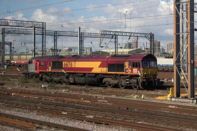 37510 & 66176, stabled, Wembley Yard 
 37510 'Orion' is just seen tucked in behind 66176 as they both sit idle in Wembley Yard. There have been a number of recent light engine moves by Class 37 up the West Coast Mainline from their base in Leicester over the last few Sundays so I wonder if this was one of these? 
 Keywords: 37510 66176 Wembley Yard Orion