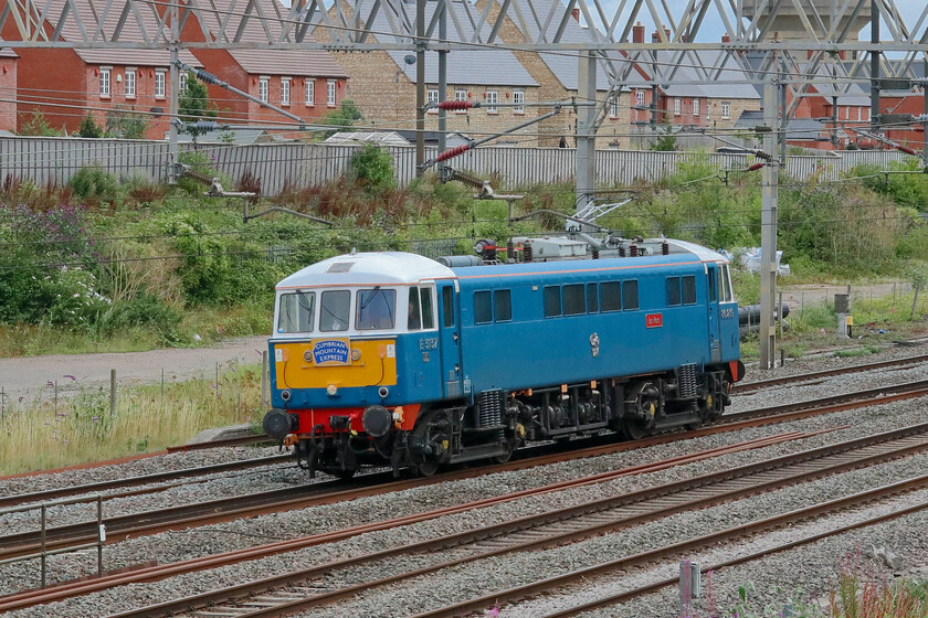 86259, 11.29 Acton Lane Reception Sidings-Rugby CS (0Z89, 26L), site of Roade station 
 After hauling another successful Cumbrian Mountain Express the previous day 86259 'Peter Pan/Les Ross' passes through Roade as the 0Z89 11.29 Acton to Rugby carriage sidings light engine. Unusually on this particular day, it was running late; a problem that appeared to from the start rather than at some point on its journey. The Class 86 is stabled between duties at Rugby and can be clearly seen at the southern end of the station 
 Keywords: 86259 11.29 Acton Lane Reception Sidings-Rugby CS 0Z89 site of Roade station Les Ross Peter Pan