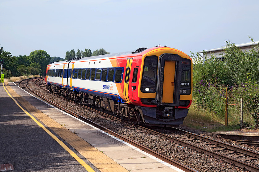 158883, SW 14.56 Salisbury-Romsey (via Southampton) (2R54, 1L), Romsey station 
 158883 arrives at Romsey station with the 14.56 Salisbury to Romsey. However, this train has not completed its journey, this is its first of two stops at Romsey It will now continue via Chandlers Ford and Eastleigh to Southampton and thence back to Romsey for the second time. 
 Keywords: 158883 2R54 Romsey station