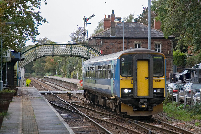 153314, LE 12.58 Norwich-Lowestoft, Brundall station 
 The 12.58 Norwich to Lowestoft Great Anglia service rattles through Brundall station worked by 153314. It will not be very long (scheduled for 2017) before the lines east of Norwich will be dragged into the modern railway age with the wiping away of the Victorian infrastructure seen here. 
 Keywords: 153314 12.58 Norwich-Lowestoft Brundall station Greater Anglia GA