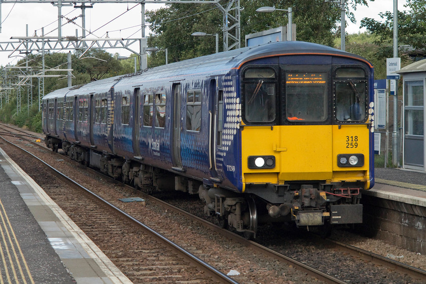 318259, SR 17.26 Cumbernauld-Dumbarton Central (2V55, 1L), Cumbernauld station 
 Having arrived at Cumbernauld we had a decision to make. Did we wait for a couple of a freights heading this way or head back towards Glasgow and then on to Ayr for what would be a pretty late shower and a meal? We decided to head straight back so, after it had gone into a refuge siding and reversed back into the station we took 318259 working the 17.25 to Dumbarton Central as far as Stepps station. 
 Keywords: 318259 2V55 Cumbernauld station