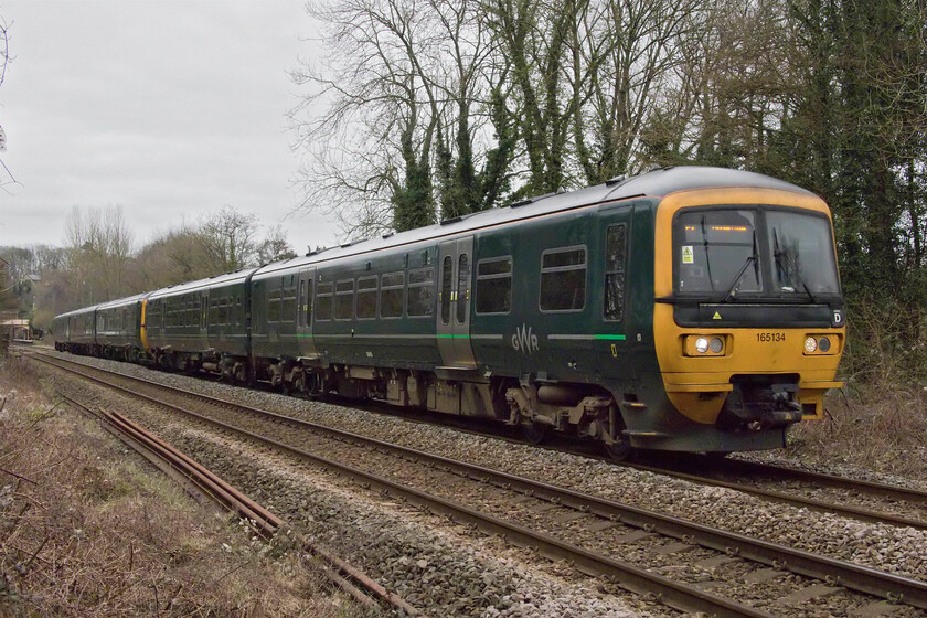 165134 & 166204, GW 08.23 Portsmouth Harbour-Cardiff Central (1F10, 11L), Bradford-on-Avon no. 1 crossing ST822605 
 With crowds gathering on the foot crossing just west of Bradford-on-Avon station the driver of 165134, with 166204 at the rear, accelerates away from the station with the 08.23 Portsmouth Harbour to Cardiff Central service. The crowd of observers were made up of enthusiasts and normals eager to witness the passing of a steam charter hauled by recently overhauled and re-certified 45699 'Galatea'. 
 Keywords: 165134 166204 08.23 Portsmouth Harbour-Cardiff Central 1f10 Bradford-on-Avon no. 1 crossing ST822605 GWR Great Western Railway Turbo