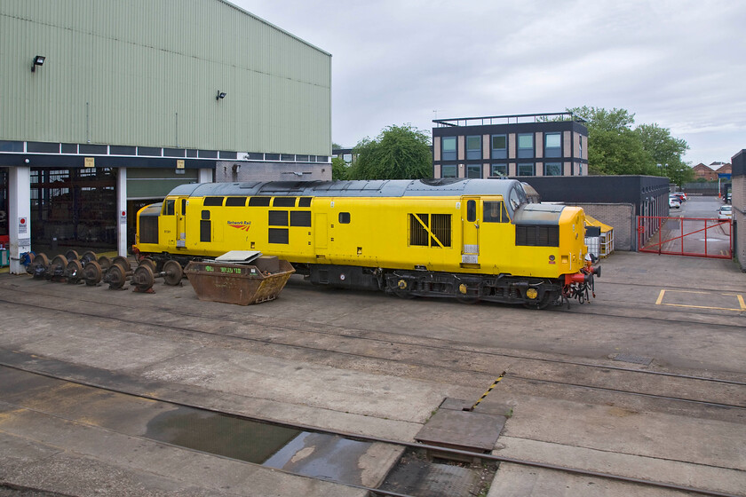 97301, stabled, Derby REVL 
 Passing Derby's REVL (Railway Vehicle Engineering Ltd) is always a bit of a treat for the enthusiast as there a lot of stock to be seen from the passing train. Network Rail liveried and branded 97301 stands outside one of the maintenance sheds between duties. As D6800 and later 37301 this member of the class was based for nearly all of its life in and around Yorkshire but for a brief foray to Gateshead. In 2007 it was saved from being scrapped and became 97301 after refurbishment at Barrow Hill. Along with three other members of the class it has been fitted with ERTMS signalling equipment and is used primarily on the Cambrian lines from Shrewsbury to Aberystwyth and Pwllheli, which requires trains to have this type of onboard signalling equipment. 
 Keywords: 97301 stabled Derby REVL Network Rail