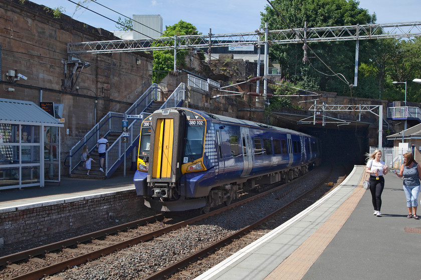 380102, SR 13.25 Glasgow Central-Gourock (1G55, 1E), Greenock Central station 
 350102 enters Wellpark Tunnel just east of Greenock Central station working the 13.25 Glasgow Central to Gourock service. Greenock central station was once a very impressive station built by the Glasgow, Paisley and Greenock Railway in 1841. It now has only two platforms and some remnants of the original station such as the substantial wall to the left in this image. 
 Keywords: 380102 1G55 Greenock Central station