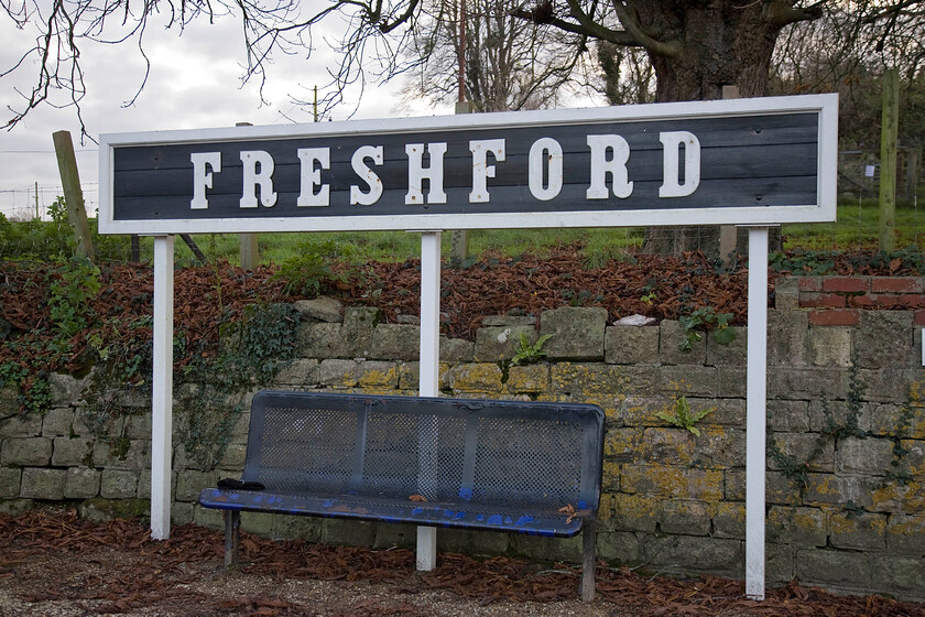 Reproduction wooden running in board, Freshford station 
 Freshford station in the glorious Avon Valley is the second nearest station to my childhood home near Bradford-on-Avon. However, I rarely used it all those years ago due to it being located, rather inconveniently, on the other side of the River Avon with no suitable place to cross and access it. The station is now nicely and carefully looked after, very different from what I remember in the 1970s, now complete with this reproduction GWR-style running-in board. 
 Keywords: Reproduction wooden running in board Freshford station