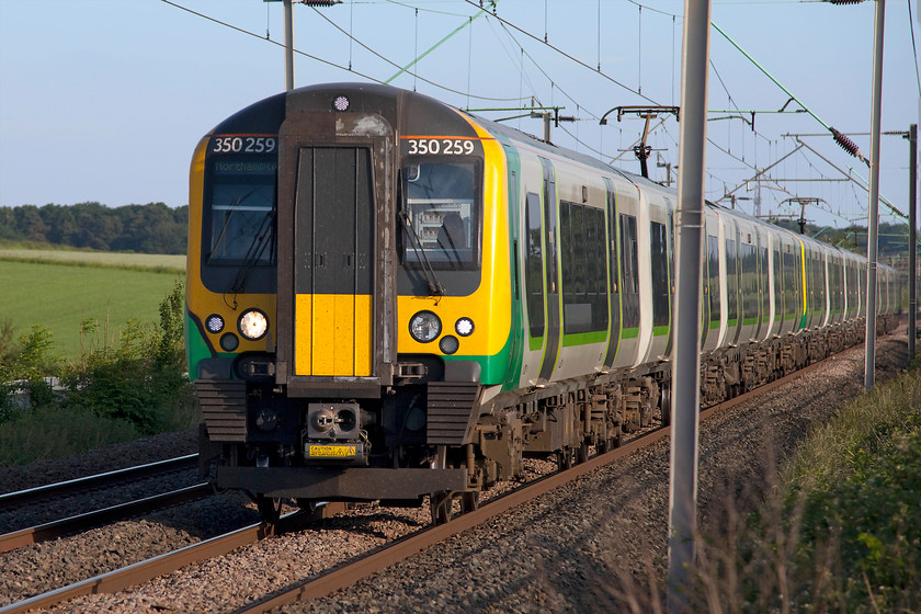 350259, 350242 & 350129, LN 17.52 London Euston-Northampton (2N51, 3L), Milton Malsor 
 One of the evening commuter 'stopper' workings passes Milton Malsor just outside of Northampton. This 2N51 is the 17.52 London Euston to Birmingham New Street. This train takes a fair while to cover the distance but it does make many stops at poorly served stations like Cheddington. 
 Keywords: 350259 350242 350129 2N51 Milton Malsor