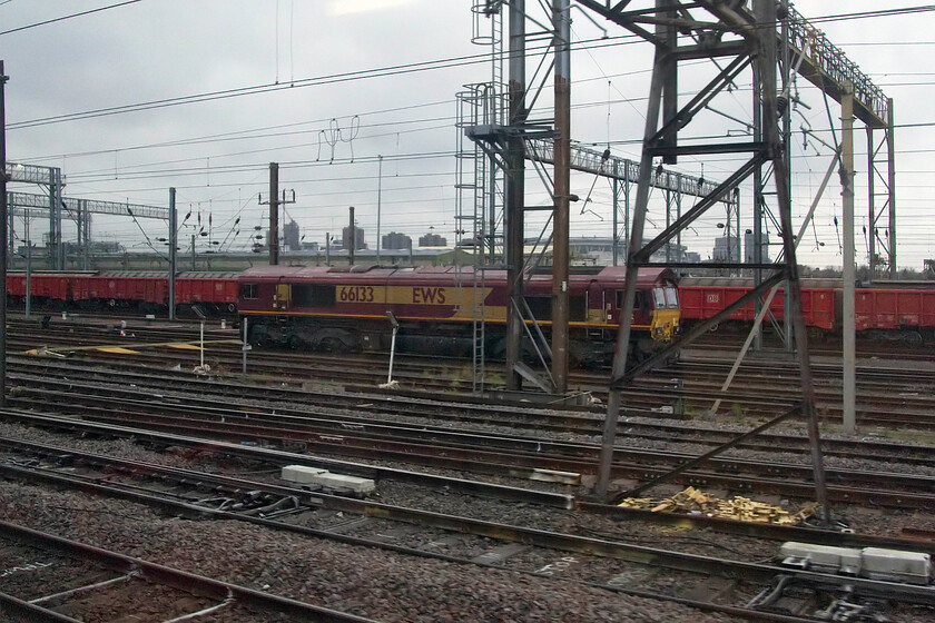 66133, stabled, Wembley Yard 
 I have very few photographs of 66133 so I have included this rather poor quality one taken from the train as we pass in Wembley Yard. The last time that I saw and photographed this locomotive was 'up north' back in the summer of 2019, see.... https://www.ontheupfast.com/p/21936chg/27343881204/x66133-12-32-lackenby-b-s-c-scunthorpe . 
 Keywords: 66133 Wembley Yard