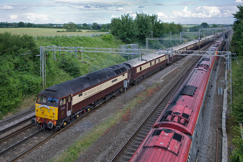 47790, 18.18 Milton Keynes-London Euston via Northampton & Class 221, VT 17.40 London Euston-Glasgow Central (9S47), Victoria bridge 
 47790 'Solway Princess' has just left Milton Keynes and is heading north to get to London! It will go as far as Northampton where the locomotive will run round and lead the train south to its destination passing this same spot in about forty-five minutes. The Northern Belle charter is carrying racegoers back from the British Grand Prix at nearby Silverstone who will enjoy some fine dining on the train to round off their day but they will not be toasting a British victory with Nico Rosberg taking the chequered flag. 
 Keywords: 47790 18.18 Milton Keynes-London Euston via Northampton Class 221 17.40 London Euston-Glasgow Central 9S47 Victoria bridge Virgin West Coast Voyager Solway Princess