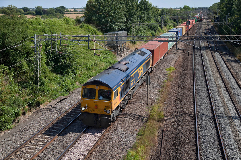 66712, 10.46 Felixstowe North-Birch Coppice (4M29), Victoria Bridge 
 66712 'Peterborough Power Signalbox' leads the 10.46 Felixstowe to Birch Coppice 4M29 Freightliner. This was year another hot and dry day that characterised the summer of 2018 that lead to water shortages and heathland fires. 
 Keywords: 66712 10.46 Felixstowe North-Birch Coppice 4M29 Victoria Bridge