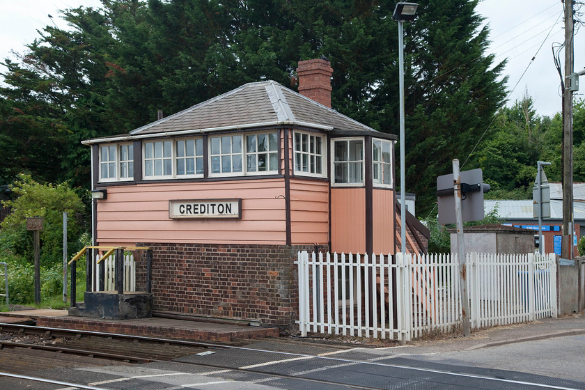 Crediton signal box (LSW, 1875) 
 Crediton is a grade II listed structure and is largely original. It has had some recent tasteful and in-keeping renovation. It sits at the level crossing immediately west of the station it contains a panel installed in 1984 when the Exeter PSB was opened. It controls the length of the Tarka line and contains a lovely token instrument that operates under the No Signalman Token Remote (NSTR) system. 
 Keywords: Crediton signal box