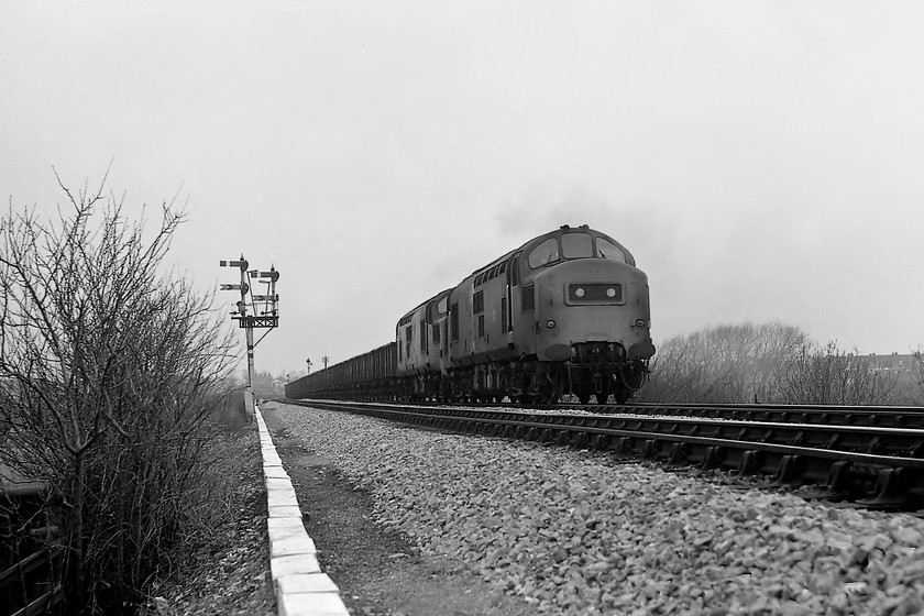 37294 & 37183, up freight, Heywood Road 
 You can almost hear the noise from the two 1750Hp English Electric 12CSVT engines as 37294 and 37183 get their up freight underway from Westbury heading towards Heywood Junction. I suspect that this was some sort of stone train heading to the London area. Both locomotives still exist. The leading locomotive is now preserved at the Embsay and Bolton Abbey Railway after being withdrawn in 2009. The second locomotive, 37183, is still in front-line service as 37884 'Cepheus' owned by Europhoenix and operated by the Rail Operations Group. 
 Keywords: 37294 37183 up freight Heywood Road