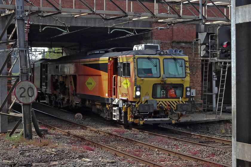 DR73947, 09.00 Bletchley CE Sidings-Worcester TC (6J62, 19L), Northampton station 
 Colas' Plasser and Theurer Switch and Crossing Tamper DR73947 passes through Northampton just going under St.James Road bridge to the south of the station. The track machine was working as the 6J26 09.00 Bletcheley Yard to Worcester. 
 Keywords: DR73947 09.00 Bletchley CE Sidings-Worcester TC 6J62 Northampton station