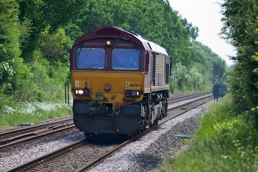 66094, 12.45 Peterborough-Mountsorrel Sidings, Egleton SK869070 
 Working light engine, 66094 passes Egleton between Oakham and Manton Junction as the 12.45 Peterborough to Mountsorrel. Just showing up in the background is Manton Junction's distant signal. A electric colour light operated by the 1913 Midland signal box. 
 Keywords: 66094 Egleton SK869070