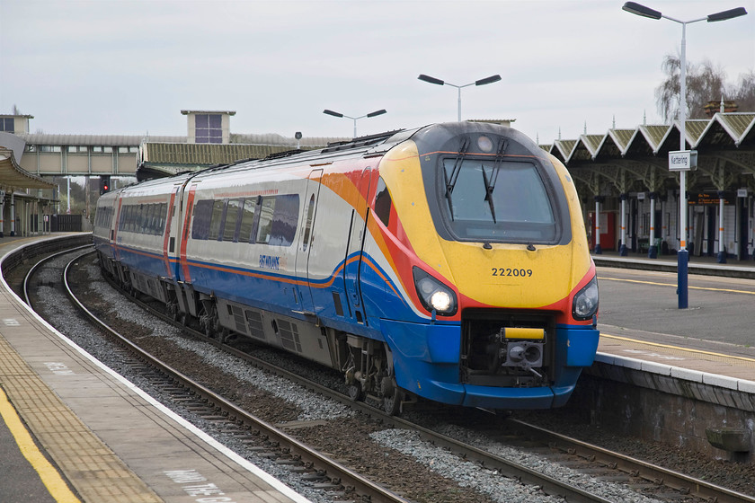 222009, EM 10.01 London St. Pancras-Corby (1M21), Kettering station 
 222009 pauses at Kettering station working the 10.01 St. Pancras to Corby East Midlands Trains service. After the expected rows and arguments between the DfT and the franchise holder regarding track access and appropriate rolling stock regular services to and from Corby eventually began five years ago in the summer of 2009. There is now an hourly service in each direction totalling twenty-six trains per day. 
 Keywords: 222009 10.01 London St. Pancras-Corby 1M21 Kettering station East Midlands Trains