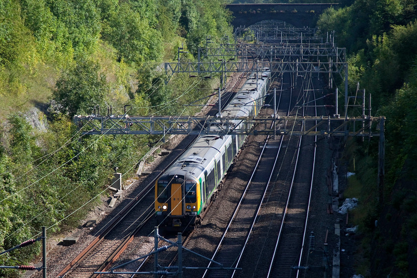 350114 & 350125, LM 14.49 London Euston-Birmingham New Street (1W17, 2L), Roade Cutting 
 350114 and 350125 bring the 14.49 Euston to Birmingham New Street through a lovely sunny Roade Cutting. I love photographing in the cutting as it offers so many different vantage points and possibilities. 
 Keywords: 350114 350125 1W17 Roade Cutting