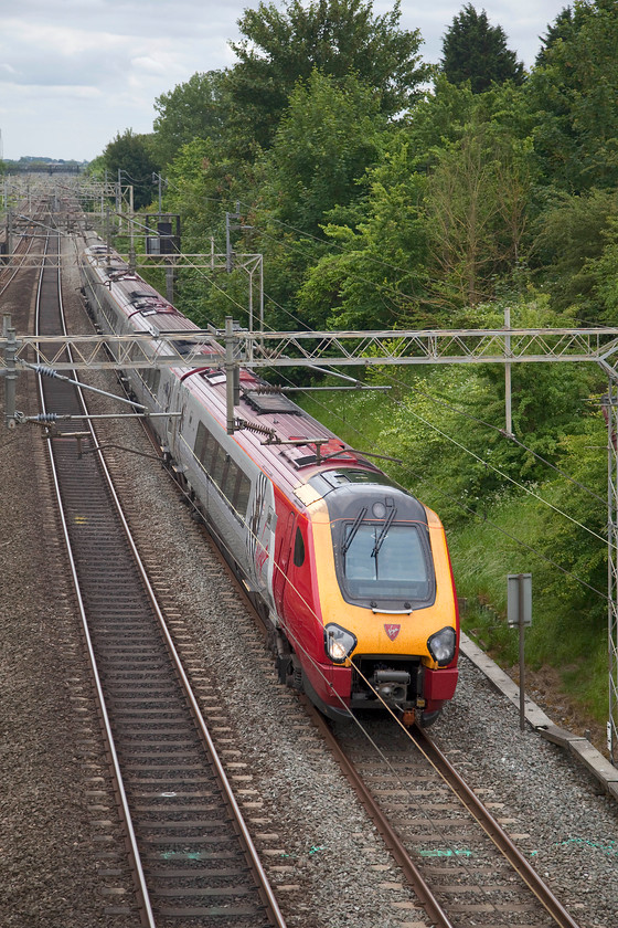 Class 221, VT 14.10 London Euston-Chester (1D88, 1E), Victoria Bridge 
 A class 221 speed noisily northwards with all of its Cummins QSK19 engines at full chat working the 1D88 14.10 Euston to Chester. It is seen passing a dull Victoria Bridge just south of Roade in Northamptonshire. 
 Keywords: Class 221 1D88 Victoria Bridge