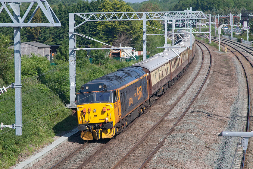 50049, 06.49 London Victoria-Kidderminster SVR (1Z60, 2L), Sharnbrook TL001598 
 Clinging on for dear life 50049 'Defiance' is seen swinging about on the rear of the outward leg of a 'private' GBRf charter from London Victoria to the Severn Valley Railway running as 1Z60. It is seen passing Sharnbrook in Bedfordshire with 66737 'Lesia' leading at the front. I hope that the invited travellers enjoyed their trip on board the VSOE Pullman stock. 
 Keywords: 50049 06.49 London Victoria-Kidderminster SVR 1Z60 Sharnbrook TL001598 Defiance GBRf