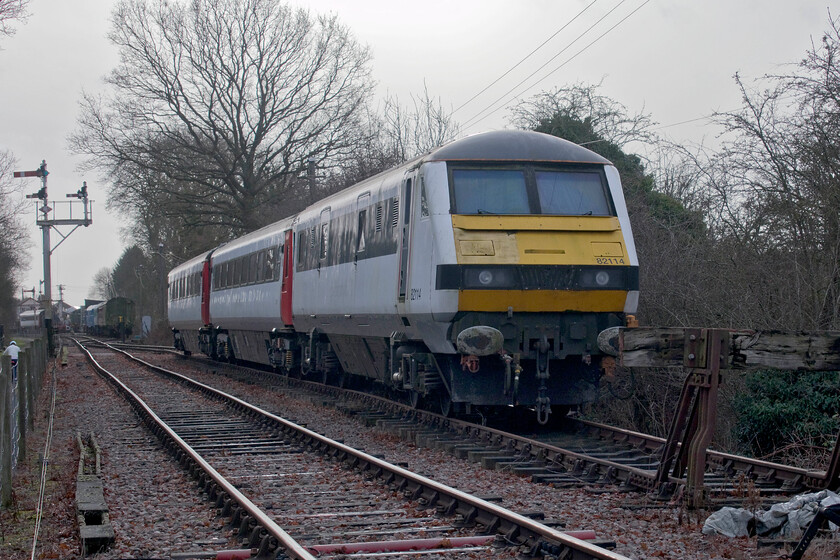 82114, stabled, Pitsford sidings 
 2023 will be the third year that the former Greater Anglia stock, including the DVT 82114, has been at the Northampton and Lamport Railway. As yet, apart from one of the Mk.IIIs being used as a buffet, none of the new stock has seen any use or been in receipt of any attention. During this time it is deteriorating with rust bubbling around the frames and a number of broken windows. I hope that things begin to move on with this stock this year even if it does not quite historically fit into the railway! 
 Keywords: 82114 stabled Pitsford sidings GA Greater Anglia DVT