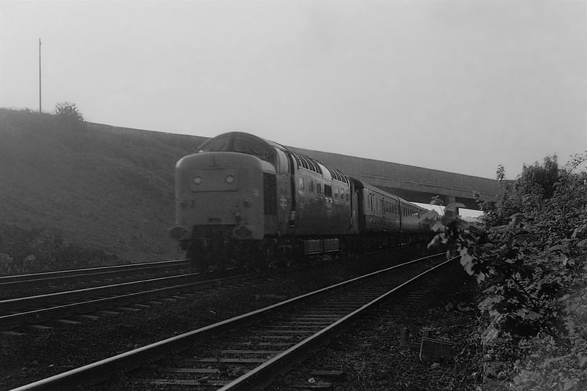 Class 55, 18.50 Leeds-London Kings Cross (1A18), Grantham SK920344 
 Unfortunately, an unidentified Deltic passes under Grantham's South Parade Bridge with the 18.50 leeds to King's Cross Sunday evening service. I am not proud and it's not clever, but I did climb the fence and negotiate the bank to take this picture from the cess. Technically not a brilliant picture as it is into the setting sun but as it's a Deltic, it's made the final cut! 
 Keywords: Class 55 18.50 Leeds-London King's Cross 1A18 Grantham SK920344