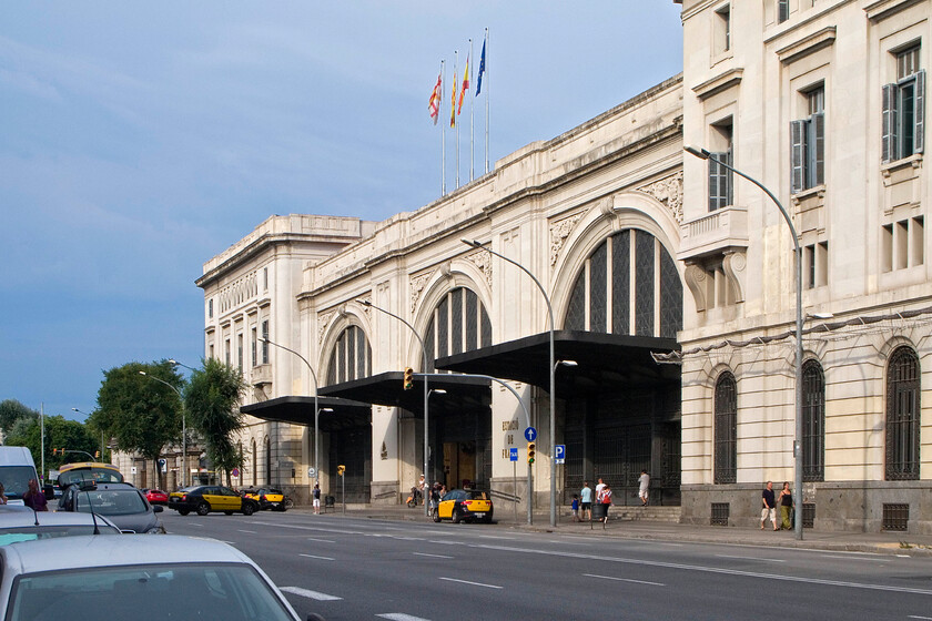 Frontage, Barcelona Frana Station 
 The imposing frontage of Barcelona Frana Station looks superb on this hot summer afternoon. It was opened in 1848 and for many years was Barcelona's principal station until the opening of the subterranean Saints station in 1975. Initially, it was constructed to accommodate international services from France, hence its name, but increasingly it began to serve regional services and now many commuter trains, including the airport shuttle train, use the station. 
 Keywords: Frontage Barcelona Frana Station