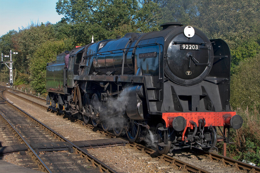 92203, running round, Holt station 
 David Sheperd's 9F 92203 'Black Prince' runs round its stock at Holt station. This manoeuvre at the North Norfolk Railway's western terminus means that return services have to run tender first. There are discussions taking place about installing a turntable meaning an end to tender first operations but equally, there are plans to extend the line another mile or so parallel with the A148 to a new terminus much closer to Holt's town centre. 
 Keywords: 92203 running round Holt station Black Prince 9F