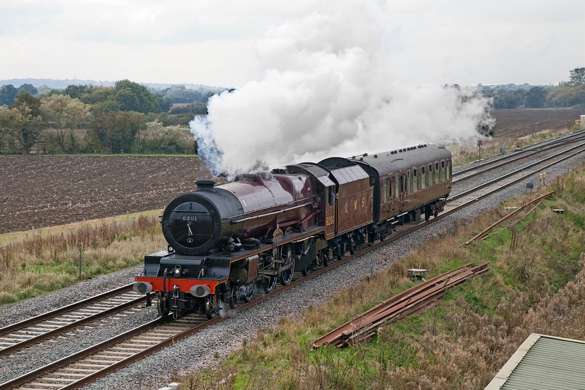 6201, 11.53 Gloucester-Southall WCR (5Z62), Bourton SU228874 
 Jubilee 4-6-0 6201 'Leander' runs along the GWML past Bourton just eats of Swindon with just one support coach in tow. It is undertaking the 11.53 Gloucester to Southall 5Z62 positioning move following railtour duties the previous week when 6201 failed at Gloucester. It was fixed on site and is now returning to its base in order to operate another railtour to Salisbury the coming Saturday. 
 Keywords: 6201 11.53 Gloucester-Southall WCR 5Z62 Bourton SU228874