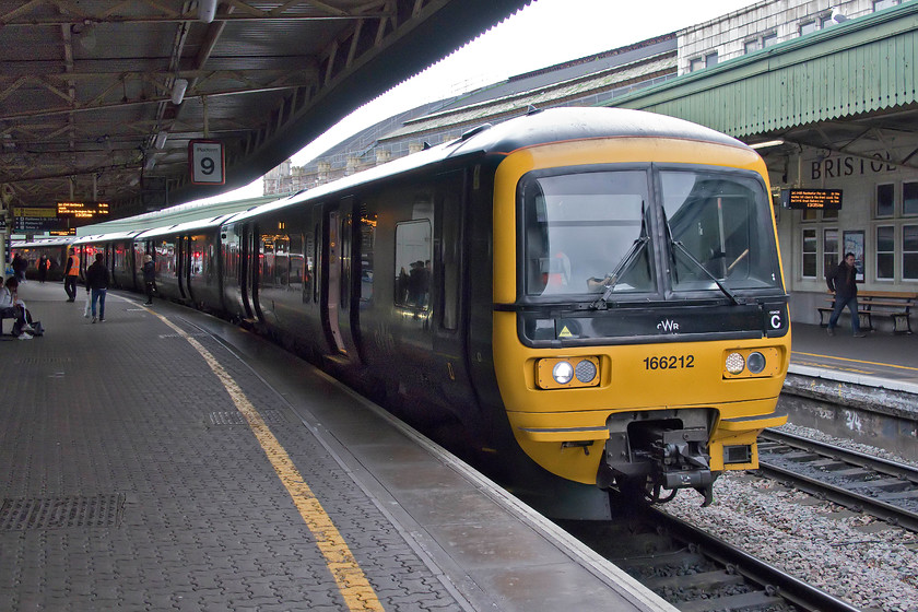 166212, GW 13.44 Bristol Temple Meads-Frome (2C18, 2L), Bristol Temple Meads station 
 With the Class 150s largely banished from the Bristol area, the far superior former Thames Valley turbo units are now operating in their place. This is the first time that I have traveled in the Bristol area since their introduction and it takes a bit of getting used to them seeing them. Here, 166212 waits at platform nine with the 13.44 departure to Frome. My wife and I took this stopper service all the way to the Somerset town where my mum and her partner live. 
 Keywords: 166212 13.44 Bristol Temple Meads-Frome 2C18 Bristol Temple Meads station Thames Valley Turbo