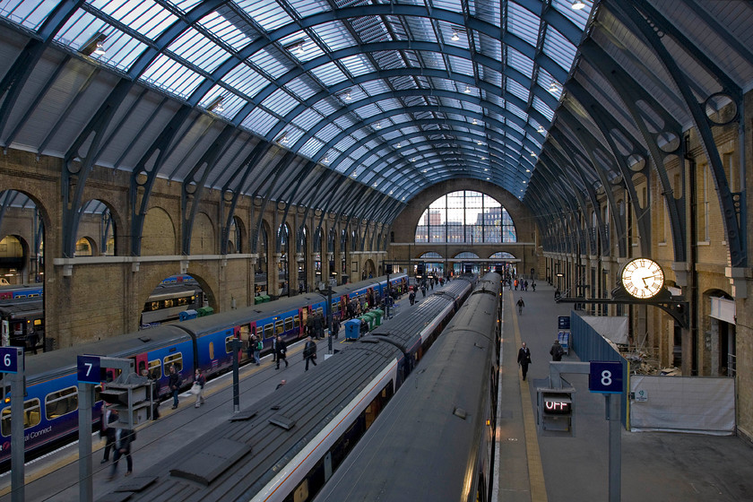 From footbridge, London Kings's Cross station 
 The inner train shed of Sir William Cubitt's iconic King's Cross station is seen from the footbridge that traverses and links all platforms. Whilst there is still contractor work being undertaken following its protracted redevelopment it does look absolutely superb with plenty of natural light flooding in despite it being a late February afternoon. When it opened in the autumn of 1852 King's Cross was the biggest station in England. 
 Keywords: London Kings's Cross station