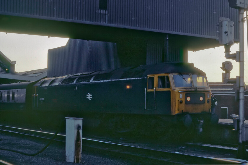 47090, Bristol Temple Meads-York returning ADEX (1Z40), Bristol Temple Meads station 
 A very poorly lit photograph of 47090 'Vulcan' at Bristol Temple Meads under the huge Royal Mail conveyor bridge that thankfully has now been removed to reveal once again the full grandeur of the 1870 train shed. After considerable research, it appears that 47090, incidentally still with us today as Riviera Trains' 47843, was leading a returning ADEX to York running as 1Z40 unless somebody else can correct me? Bearing in mind this date was still some two weeks before the clocks changed to BST the setting sun must have been very low in the sky by this stage of the day hence the poor lighting. The slide was one resurrected from the 'rejects' box that needed a fair amount of work in Photshop. 
 Keywords: 47090 Bristol Temple Meads-York returning ADEX 1Z40 Bristol Temple Meads station Vulcan