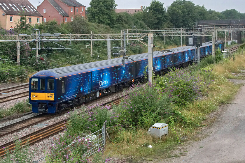 768001 & 57312, 08.44 Wembley HS-Hams Hall (5Q66, RT), site of Roade station 
 Former Thameslink 319010 is seen passing Roade being towed by 57312. It has now been converted into a bi-mode unit that has been stripped out and prepared to carry freight between Euston and Glasgow. It is seen running as the 5Q66 08.44 Wembley HS to Hams Hall. I suspect that when Orion starts its commercial operations later this year the opportunities to photograph its trains will be limited as they will be running through the night. 
 Keywords: 768001 57312 08.44 Wembley HS-Hams Hall 5Q66 site of Roade station Orion Logistics 319010