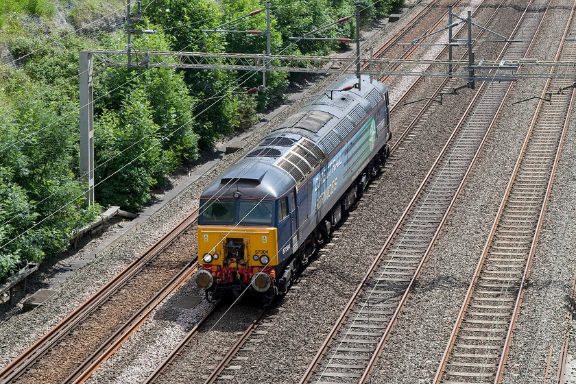 57304, 12.07 Wembley-Crewe Gresty Bridge, Roade Cutting 
 57304 'Pride of Cheshire' runs light engine through the glorious Roade Cutting as the 12.07 Wembley to Crewe Gresty Bridge. This former Virgin Thunderbird, named 'Gordon Tracy', was converted from 47807 in 2002. Under TOPS it was 47055 that I saw passing a snowy Bradford-on-Avon in December 1978..... https://www.ontheupfast.com/v/photos/21936chg/25511222404/x47055-parcels-bradford-avon-foot 
 Keywords: 57304 12.07 Wembley-Crewe Gresty Bridge Roade Cutting