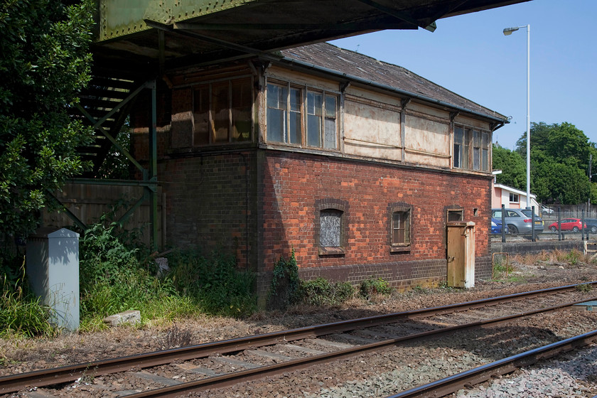 St. Austell signal box (Closed) (GW, 1906) 
 There are plans afoot to renovate and put the old St. Austell signal box and to put it to new use. Since it closed in 1980 it has seen little use and is in need of some love, care and attention. A local historical society has plans to turn it into a museum with negotiations currently ongoing with Network Rail. I last visited this location some twenty-six years previously and took a photograph from an identical angle with very little having changed in the intervening period. 
 Keywords: St. Austell signal box