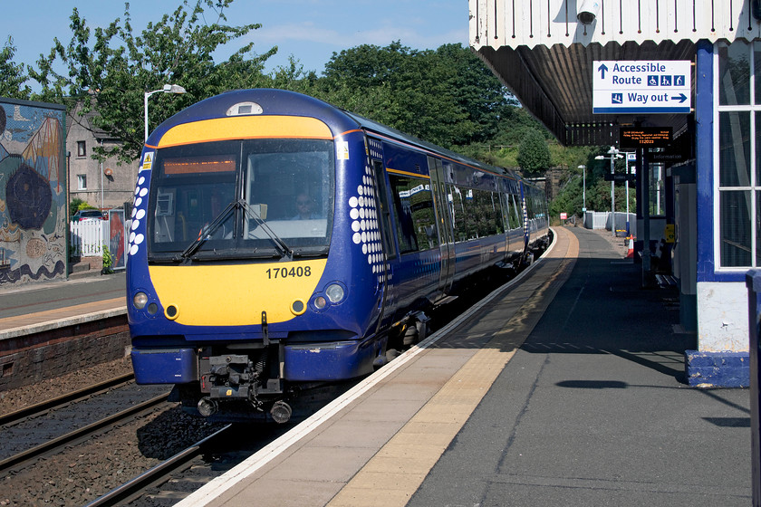 170408, SR 10.40 Glenrothes with Thornton-Edinburgh Waverley (2G08, 1L), North Queensferry station 
 170408 comes to a halt at North Queensferry station with the 10.40 Glenrothes with Thornton to Edinburgh Waverley service. Behind me is the huge structure of the Forth Bridge that the train will soon cross. North Queensferry station was very well kept with an excellent little museum on the platform contained in one of the former waiting rooms. Also, I can thoroughly recommend the toilets! 
 Keywords: 170408 10.40 Glenrothes with Thornton-Edinburgh Waverley 2G08 North Queensferry station