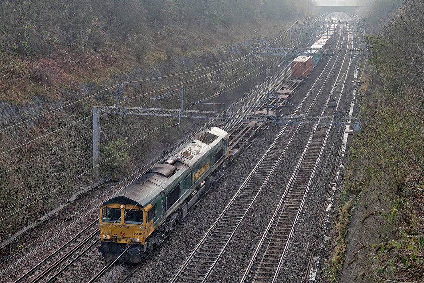 66510, unidentfied down Freightliner, Roade cutting 
 I was watching this freight on OpenTrainTimes but I could find nothing on RTT so I waited in anticipation. 66510 is seen passing through Roade cutting with a down Freightliner that, even after the event, I have not been able to identify. I even asked my friend, Mike, to have a go as he subscribes to Freightmaster but he drew a blank. All he could tell me was that 66510 spent the rest of the weekend at Lawley Street in Birmingham so I have to sumise that was its destination. 
 Keywords: 66510 down Freightliner Roade cutting Lawley Street