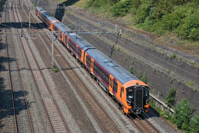 730020 & 730001, 12.30 Oxley Carr MPD-Bletchley TMD (5Q01, 4L), Roade cutting 
 The shape of things to come passes through Roade cutting. Aventras 730020 and 730001 work the 5Q01 12.30 Oxley Carr MPD to Bletchley TMD testing run. A sub-class of these units, probably wearing the London Northwestern house livery, will be replacing the Class 350/2 units and the elderly Class 319s that are still used for peak services between London and Northampton. However, in an all too familiar tale, delivery was late and testing has thrown up issues that need addressing meaning that their introduction is now extremely late. 
 Keywords: 730020 730001 12.30 Oxley Carr MPD-Bletchley TMD 5Q01 Roade cutting west midlands railway Aventra