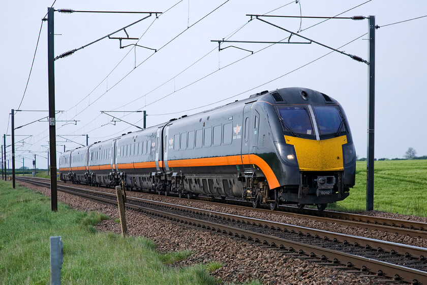 180112, GC 16.00 Bradford Interchange-London King's Cross (1A87), Frinkley Lane crossing SK906436 
 The four coaches of Grand Central's 180112 'James Herriot' just fits neatly between the electrification masts at Frinkley Lane crossing just north of Grantham. Looking very smart in its gleaming black livery 180112 was introduced to the ECML in September 2009 after receiving a complete overhaul by Railcare at Wolverton Works. 
 Keywords: 180112 16.00 Bradford Interchange-London King's Cross 1A87 Frinkley Lane crossing SK906436 Grand Central