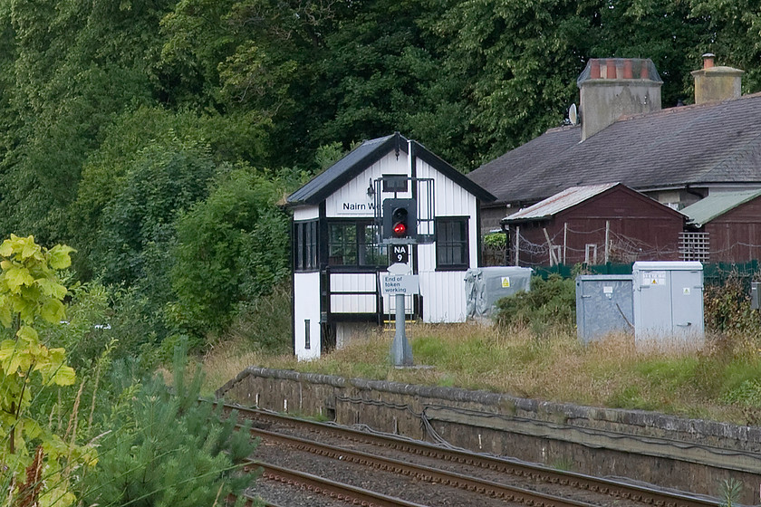 Nairn West signal box (McK&H & High, 1891) 
 Nairn West signal box closed, along with its twin at the eastern end of the station during 2000. Both boxes are McKenzie and Holland Type 3 (Highland variant) structures being very similar in design. It has been recently restored and is a category B listed structure by Historic Environment Scotland. As the station platform has been partially closed photographic access to the box is limited to this position in the former station yard. When the boxes were in use a bicycle was provided to the signalman in order to move efficiently between the two boxes with them being single manned as one. 
 Keywords: Nairn West signal box McKenzie and Holland Type 3 Highland variant