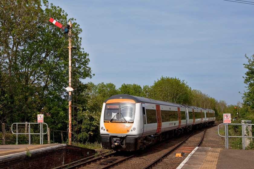 170203, LE 16.38 Norwich-Great Yarmouth (2P28, RT), Acle station 
 With the Acle home signal sitting high on its post and pulled off, 170203 leaves the station working the 16.38 Norwich to Great Yarmouth service. Greater Anglia has a small number of these class 170s to supplement its extensive fleet of other units. It had turned in to such a lovely early evening that Andy and I decided to see the 37s again before we went home. 
 Keywords: 170203 2P28 Acle station