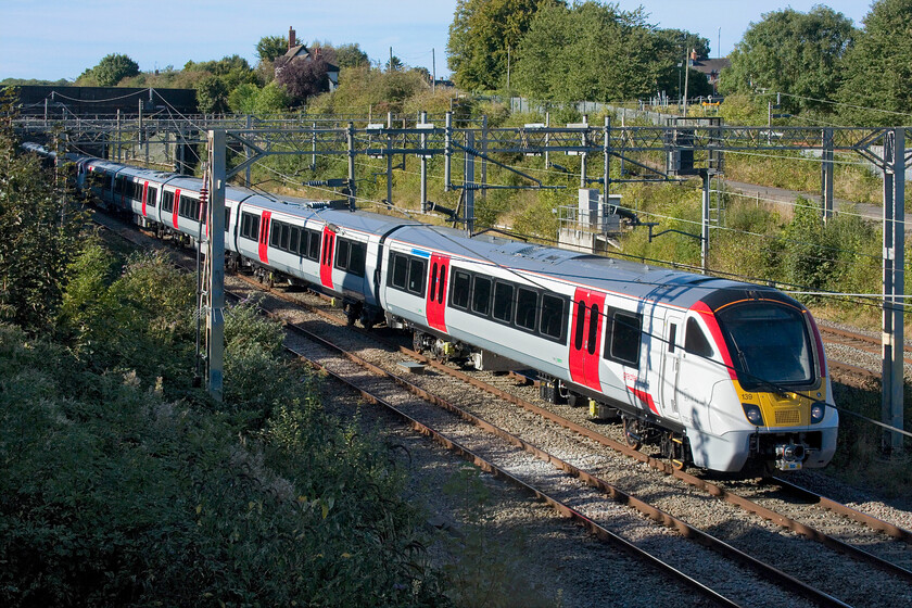 720139 & 720502, 13.53 Rugby-Wembley Yard (via Stafford) (5Q28, RT), site of Roade station 
 Testing, mileage accumulation and staff training continues apace using paths on the busy WCML. Newly built at Derby (Bombardier). 720139 and 720502 pass Roade on the up fast line working the 13.53 Rugby to Wembley Yard via reversal at Stafford. As can be seen, these units are Greater Anglia branded so I suspect that they are pretty close to entering service as in the early days of testing most units operate with no vinyls identifying their TOC. 
 Keywords: 720502 720139 13.53 Rugby-Wembley Yard via Stafford 5Q28 site of Roade station GA Greater Anglia Aventra