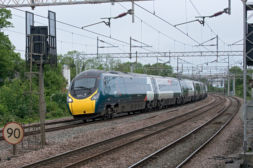 390050, VT 07.17 Liverpool Lime Street-London Euston (1A11, 8L), Wolverton station 
 390050 takes the reverse curves to the north of Wolverton station hopefully with its tilting mechanism in full operation for the comfort of passengers! The Avanti West Coast Pendolino was working the 07.17 Liverpool to Euston service that arrived a little late at its destination. 
 Keywords: 390050 07.17 Liverpool Lime Street-London Euston 1A11 Wolverton station Avanti West Coast