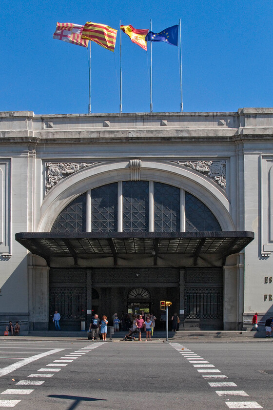 Frontage, Barcelona Frana station 
 I know that I visited Barcelona's Frana station earlier in my stay but on walking past today I could not resist another photograph of its grand facade and main entrance complete with its array of four flags fully extended catching a strong on-shore south-westerly wind. 
 Keywords: Frontage Barcelona Frana station