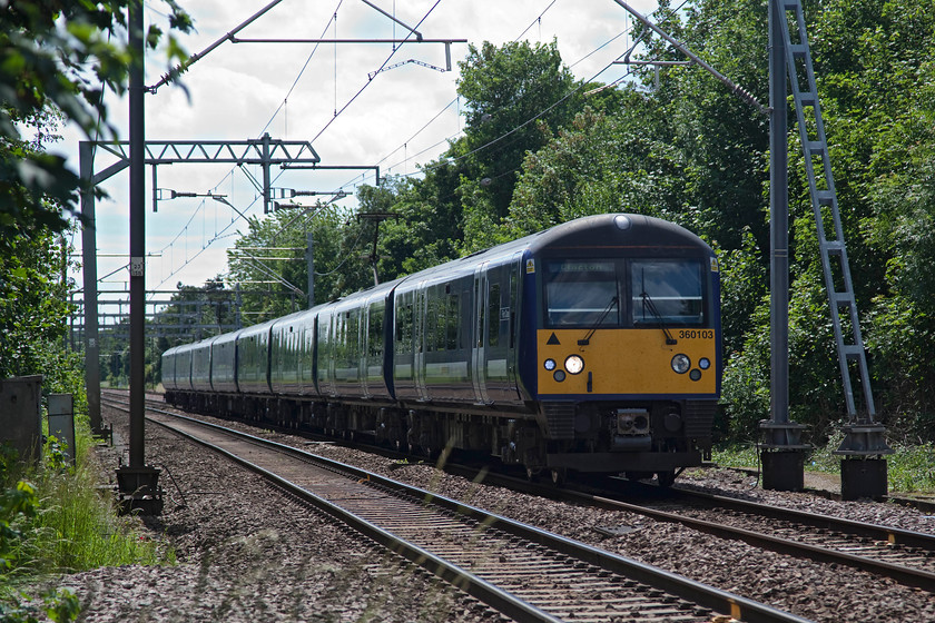 360103, GE 14.18 London Liverpool Street-Clacton (1N26, 1E), Ingatestone level crossing 
 Horribly back-lit but with a bit of Photoshop fettling a presentable image has been produced! 360103 forms the 14.18 Liverpool Street to Clacton working. It is seen approaching Ingatestone station about to cross the level crossing. 
 Keywords: 360103 1N26 Ingatestone level crossing