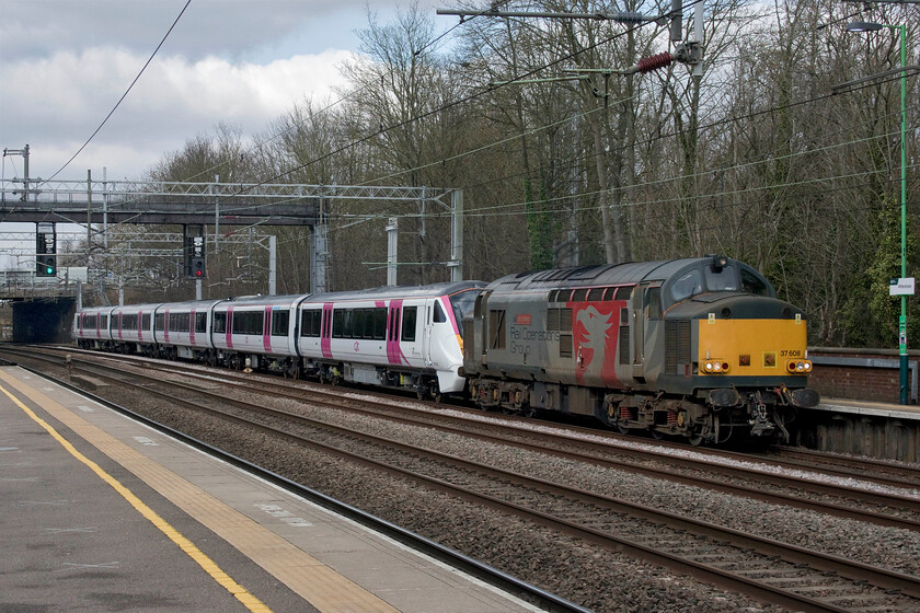 37608 & 720602, 10.08 Derby Litchurch Lane-Wembley Yard (5Q75, 2E), Atherstone station 
 The second Class 37 of our short trip to the West Midlands sees 37608 'Andromeda' leading newly built 720602 through Atherstone. The unit is part of a later order from c2c for ten five-car trains that will operate on the London, Tilbury and Southend line. I am not sure if this unit was being delivered following its construction at Litchurch Lane or if had returned there for rectification work. I say this as there are other photographs of subsequently numbered 720603 having been delivered to Essex nearly six months ago. 
 Keywords: 37608 720602 10.08 Derby Litchurch Lane-Wembley Yard 5Q75 Atherstone station ROG Rail Operations Group Andromeda