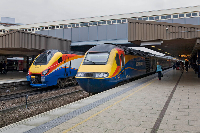 222006, EM 13.58 London St. Pancras-Sheffield (1F40) & 43049, EM 14.32 Nottingham-London St. Pancras (1B53), Leicester station 
 Two generations of East Midlands Trains stand at Leicester station. To the left is 222006 dating from 2006 is working the 13.58 St. Pancras to Sheffield service. Whilst, to the right is an HST being led by 43049 dating from 1977 that is working the 14.32 Nottingham to St. Pancras service. Out of the two, I do not need to announce here which one I would prefer to travel on but it does reinforce the old adage of old is better! 
 Keywords: 222006 13.58 London St. Pancras-Sheffield 1F40 43049 14.32 Nottingham-London St. Pancras 1B53 Leicester station East Midlands Trains EMT HST Meridian