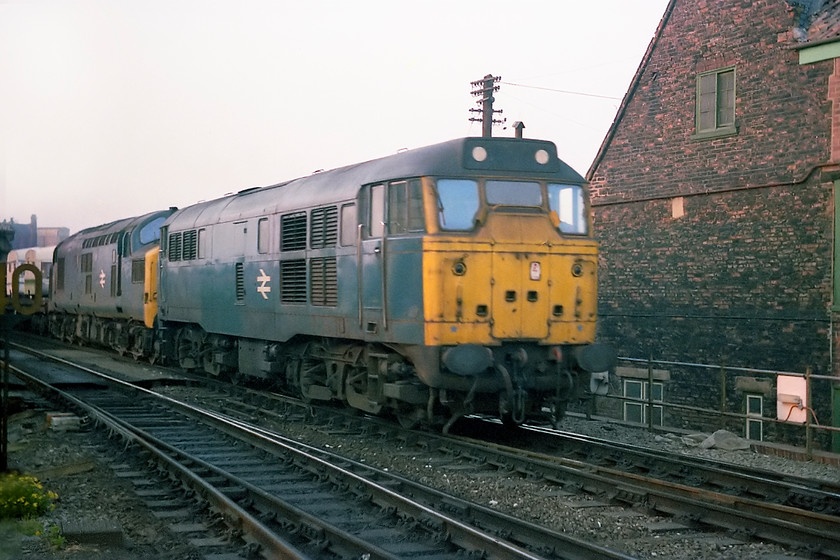 31120 & 37124, up freight (caravans), Selby station 
 Simon and I took a short evening walk from the Youth Hostel at Selby, a safely moored-up former grain barge, to the station. We observed a number of workings the first of which was this one headed by 31120 and 37124. It was carrying a number of flat wagons with caravans on them. The train could have originated from the Hull area with Sprite and Abbey 'vans being manufactured at Cottingham. I do not know if the plant was rail-linked, it was right next to the line, or if the train was even from there? Any help to solve where this working may have originated from would be appreciated. 
 Keywords: 31120 & 37124, up freight (caravans), Selby station