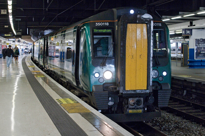 350118, LN 14.08 London Euston-Birmingham New Street, (1W59, 22L), London Euston station 
 Our train from London Euston back to Milton Keynes was uncomfortably busy. However, the usual mad dash by passengers from the concourse to the platform once its number was showing on the departures board did not happen as it was displayed extremely early that made for a lot more calm and civilised situation! 350118 and another unidentified unit will work the 14.08 service to Birmingham New Street. 
 Keywords: 350118 14.08 London Euston-Birmingham New Street 1W59 London Euston station London Northwestern Desiro