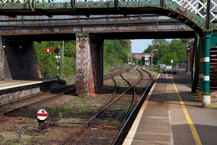 Infrastructure, Reedham station 
 What a delight Reedham station is! In this view, looking through the bridge, there is a number of Victorian relics of a by-gone railway age. As well the mechanical signalling and signal box there is the GER wrought iron footbridge. Also, a little disguised by the trees surrounding it, there is a loading gauge to the right above the trespass sign. This scene is set to change dramatically in the coming months as the whole area is to be re-signalled when much of what can be seen here will be wiped away. 
 Keywords: Reedham station