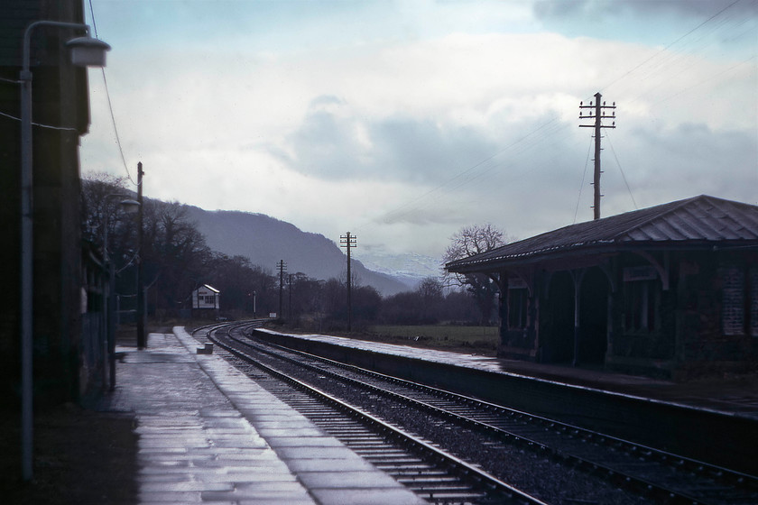 Llanrwst station & signal box (LNWR, 1880) 
 Taken on a cold and wintery morning at Llanrwst on the Conwy Valley the station and signal box are seen in this view looking north. The box is a London and North Western Railway structure dating from 1880 and is still in use today albeit as a token exchange point. The derelict station building seen here are grade II listed, as is the box, with the station now open as a request stop that is infrequently patronised. This is because in 1989, BR opened a far more conveniently located single platform station slightly further south nearer to the town centre. Thus, a small town of some 3300 people, has the luxury of two stations! 
 Keywords: Llanrwst station signal box